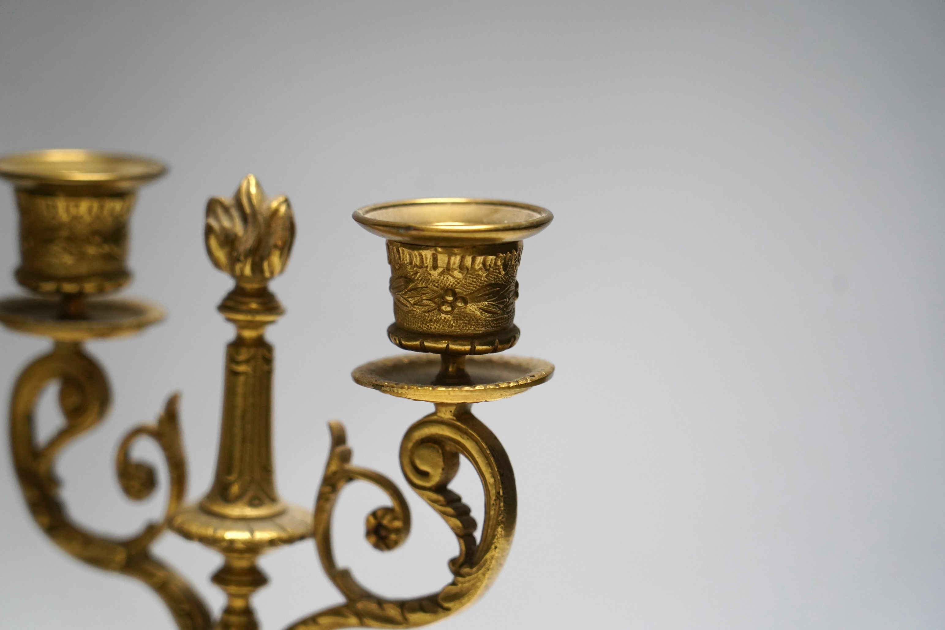 A pair of late 19th century alabaster and gilt metal two light candelabra, 22cm. Condition - good
